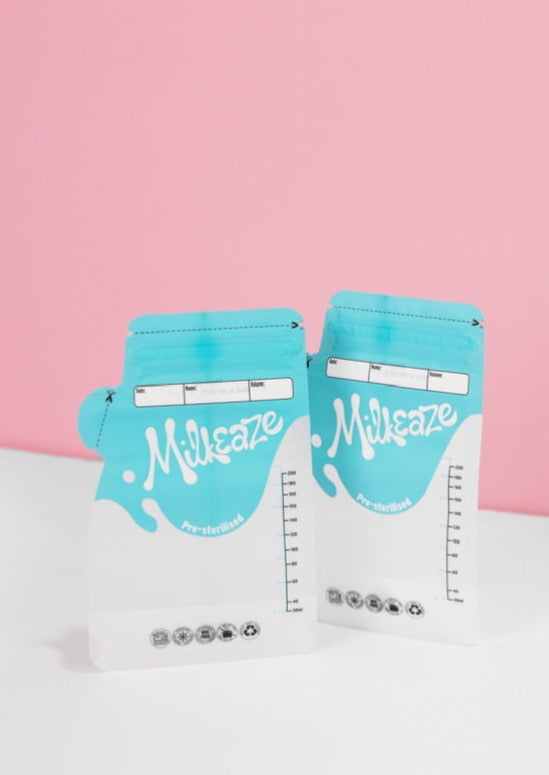 2 Milkeaze milk storage bags against a pink background 